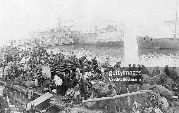 Turkey: View of the waterfront at Smyrna when thousands of refugees crowded the quayside seeking refuge from the burning city. Allied ships in the...