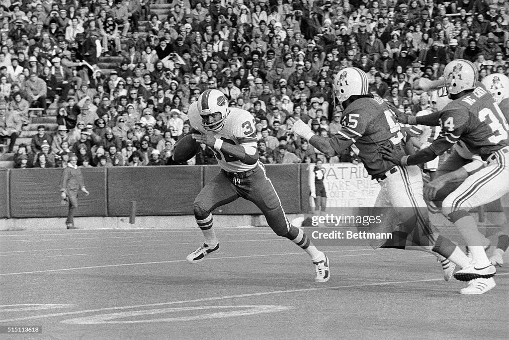 O.J. Simpson Runs with Ball Away from Patriots