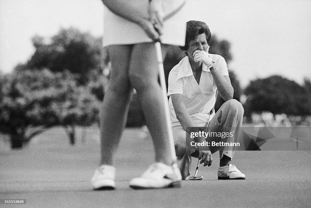 Kathy Whitworth Watching a Golfer's Putt