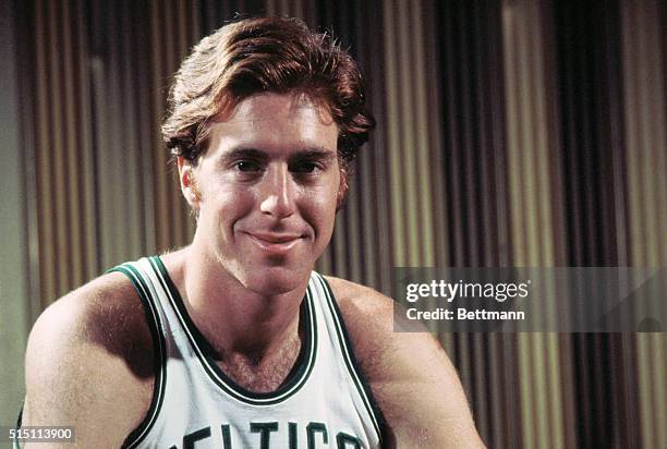 Closeup of Dave Cowens of the Boston Celtics in uniform, smiling,