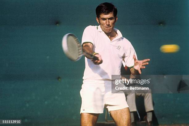 Tokyo, Japan: Ken Rosewall of Australia stretches his hands in a back volley during the men's singles final of the 1974 Japan Open Tennis Tournament...