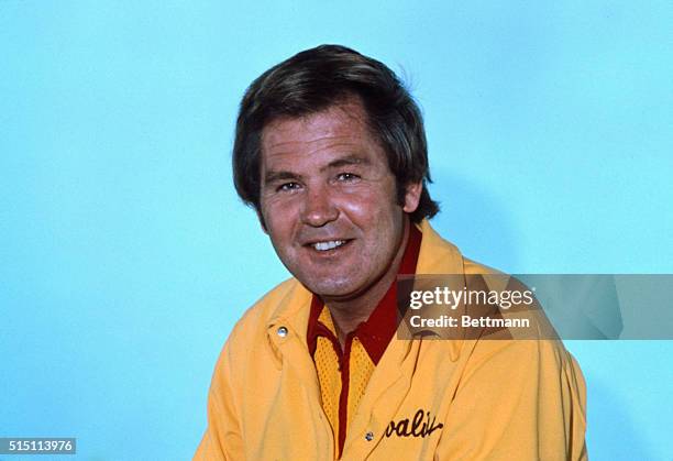 Close-up of Bill Fitch, Cleveland Cavaliers, coach, in uniform smiling. Undated color slide.