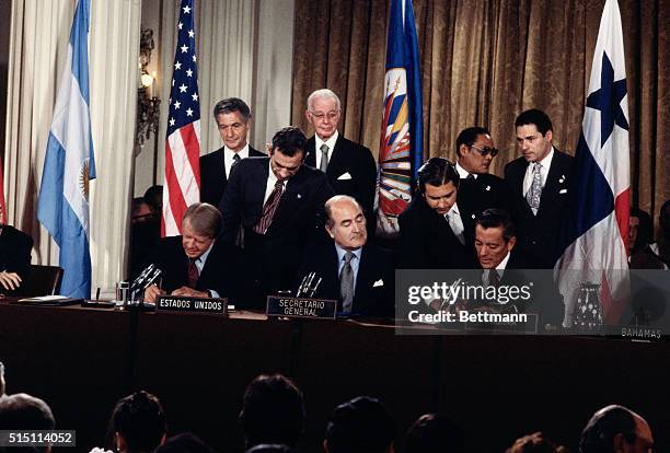 Washington, DC- President Jimmy Carter and Panamanian leader General Omar Torrijos sign the Panama Canal Treaty at the Organization of the American...