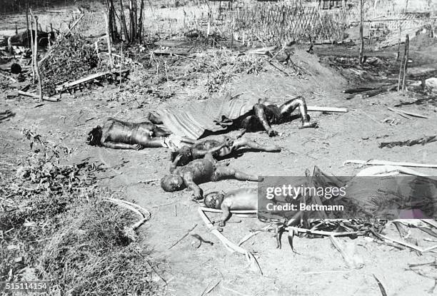 South Vietnam: The burned bodies of South Vietnamese children shown sprawled on ground after Viet Cong attack on village.