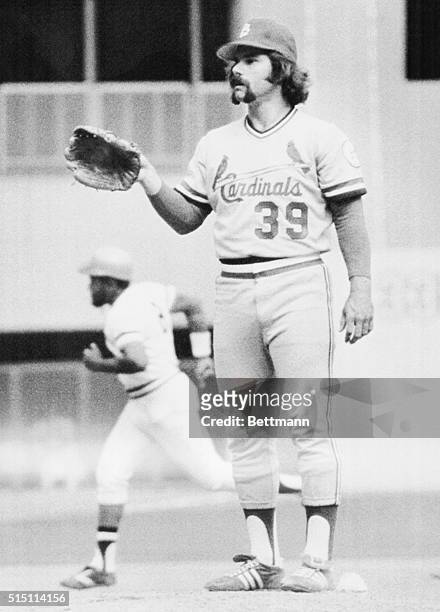 Pittsburgh, Pa.: Cards' relief pitcher Al Hrabosky signals for a new ball after Pirates' Willie Stargell, background, hit homer off him in 7th inning...