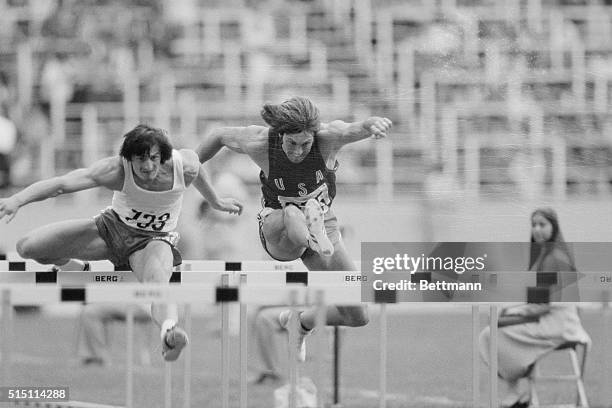 Bruce Jenner, from San Jose, California, clears the 110 meter hurdles along with Poland's Rszard Skowronek during their morning decathlon competition...