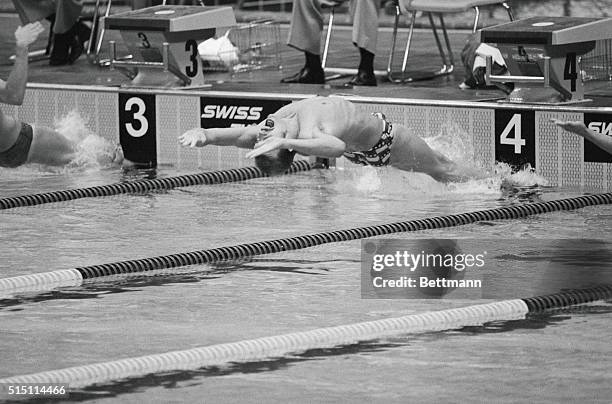 America's John Naber wears a look of total concentration as he moves out into the water 7/24 at the start of the 200 meter men's backstroke event....