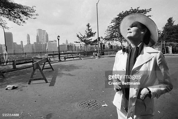 Brooklyn, New York- While actress Ava Gardner views a "profile" of Manhattan, a photographer captures hers. Ava is taking a break during her Brooklyn...