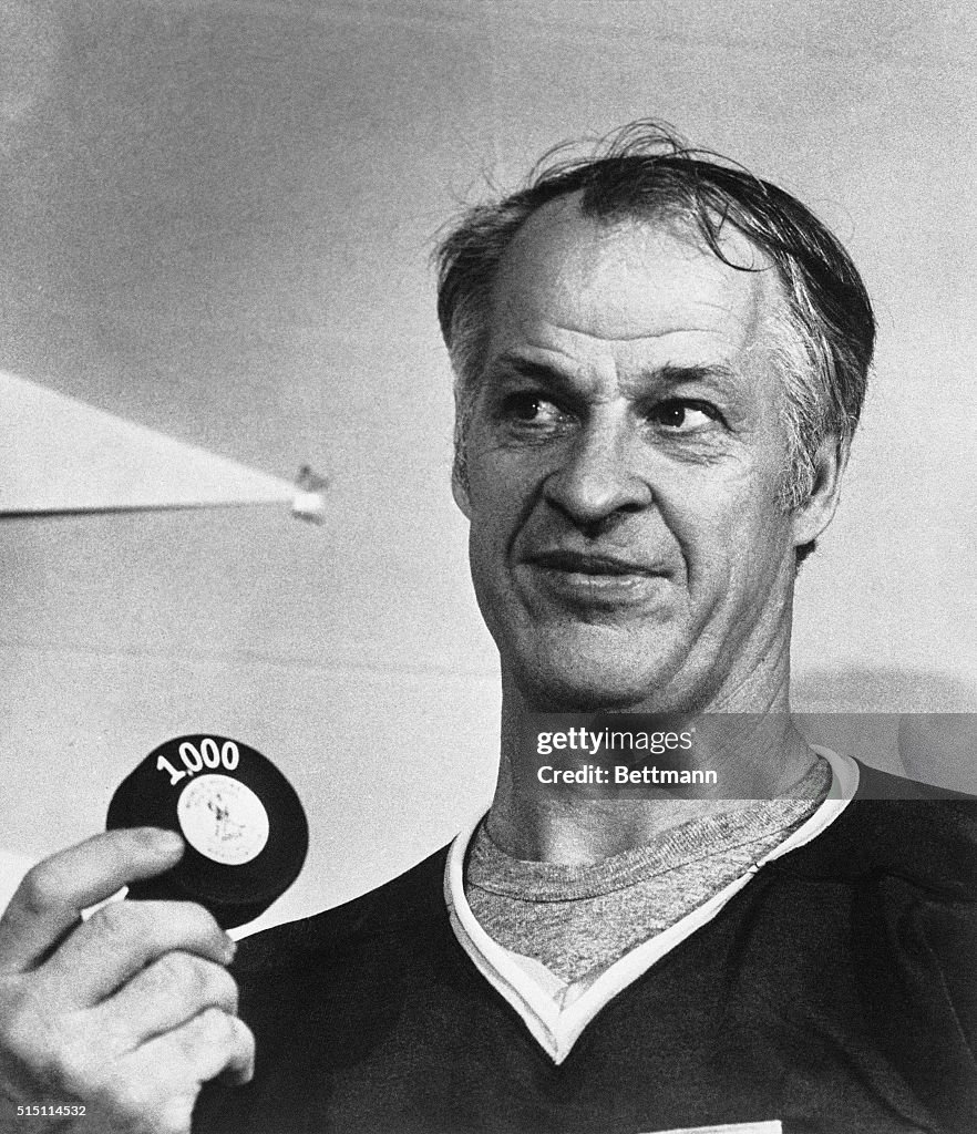 Gordon Howe Holding 1000th Goal Puck
