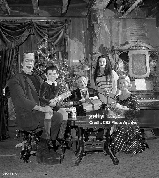 The cast of the CBS television situation comedy 'The Munsters' including American actor and children's book author Fred Gwynne , child actor Butch...