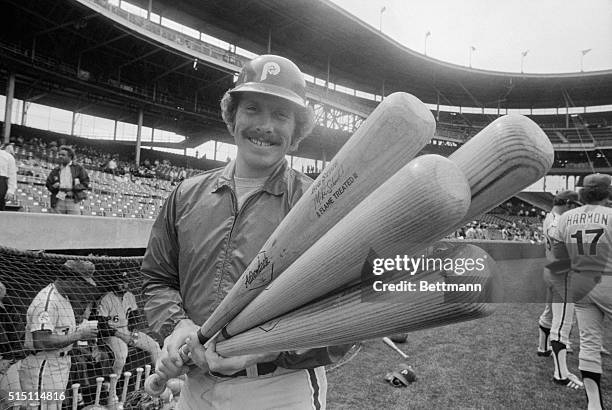 Philadelphia Phillies' Mike Schmidt holds four big bats before start of game with the Chicago Cubs 4/18. During 4/17 game with Cubs, Schmidt knocked...