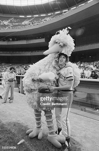New York: Mark Fidrych, Detroit's madcap pitcher who has the lowest ERA in the majors , lets out a yelp as he meets "Big Bird" of Sesame Street fame...