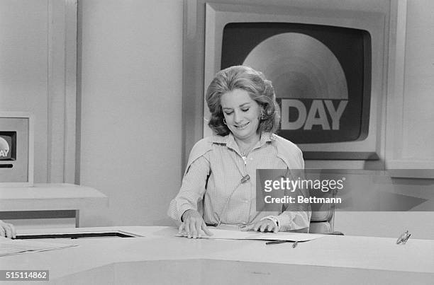 New York: A "Goodbye" For Barbara. Newswoman Barbara Walters wears big smile as she accepts "good-bye" flower from cohost Jim Hartz of the Today Show...