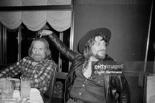 New York: Country-western singer stars Willie Nelson and Waylon Jennings celebrate at a party at the Rainbow Room in honor of their new album,...