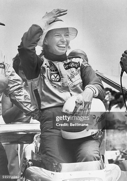 Janet Guthrie laughs as she sits in the cockpit of her car after becoming the first woman 5/22 to ever qualify for the Indianapolis 500. Her four-lap...