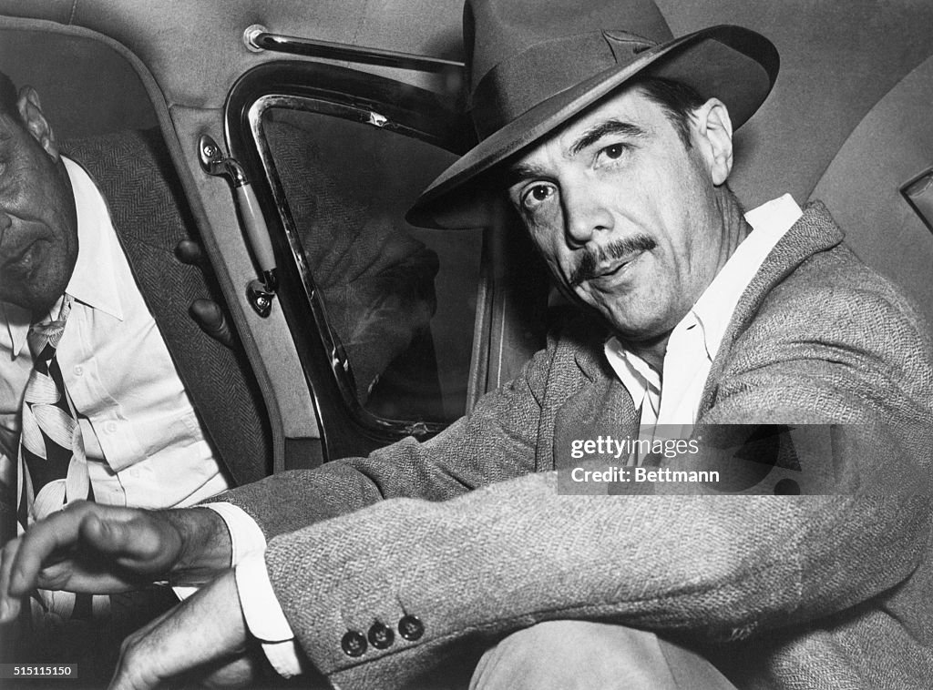 Howard Hughes Seated in Car