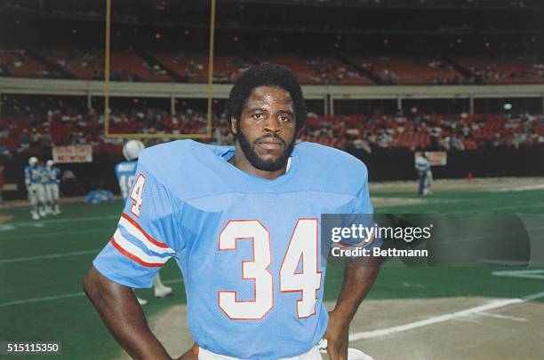 Earl Campbell, player for the Houston Oilers, posing in uniform.