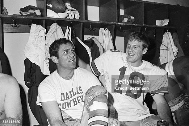 Dallas Cowboys quarterback Don Meredith, , receives a playful pat on the head from pass receiver Lance Rentzel, , in the Cowboy's dressing room after...