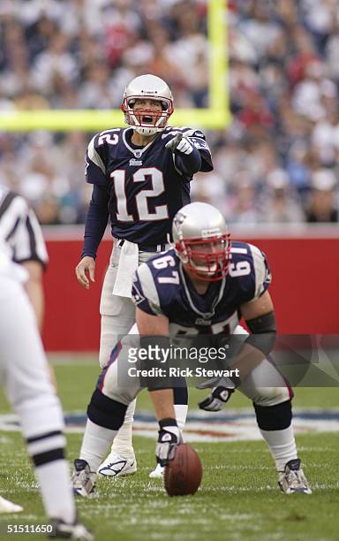 Quarterback Tom Brady of the New England Patriots and center Dan Koppen prepare for the snap against the Miami Dolphins during the game at Gillette...