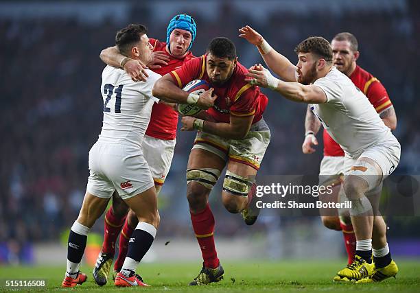 Taulupe Faletau of Wales evades a tackle from Luke Cowan-Dickie of England on the way to scoring his try during the RBS Six Nations match between...