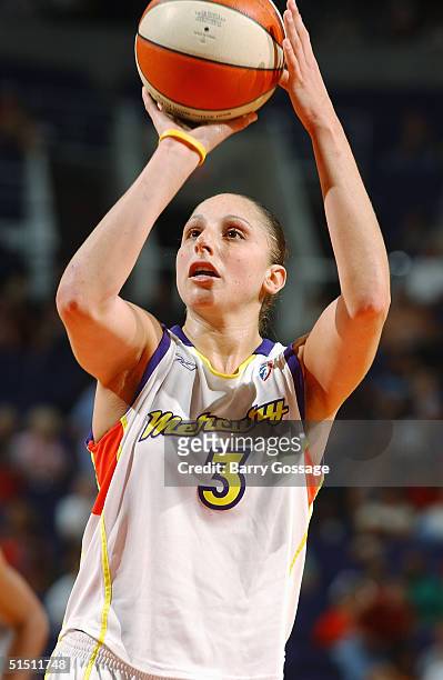 Diana Taurasi of the Phoenix Mercury shoots during a WNBA game against the Seattle Storm on September 4, 2004 at America West Arena in Phoenix,...