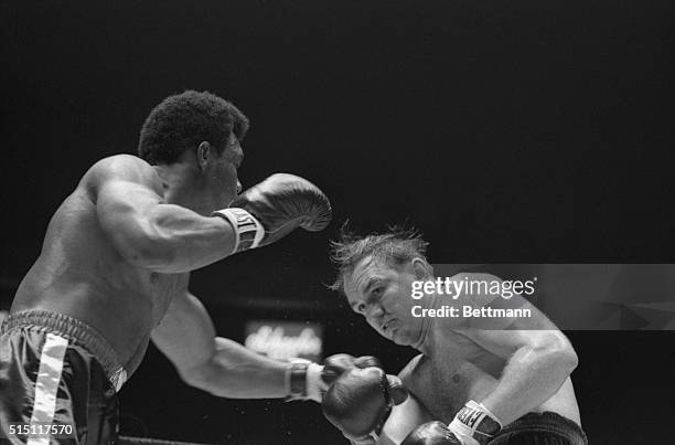 George Foreman makes a long left jab at Chuck Wepner in the second round of their fight, August 18th. Wepner's eye opened up slightly in the first,...