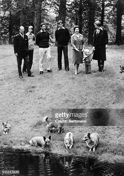 Watching the family at play on the grounds of Balmoral castle recently are members of the British royal family. Family members are : the Duke of...
