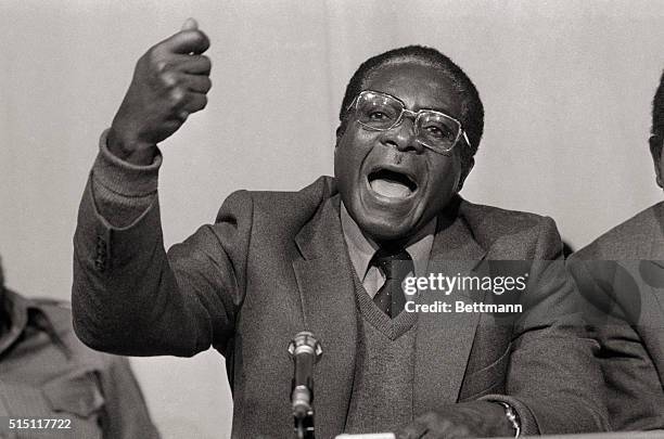 Robert Mugabe, co-leader of the Patriotic Front Guerrilla Alliance, talks to newsman December 17 at a press conference held to announce agreement on...