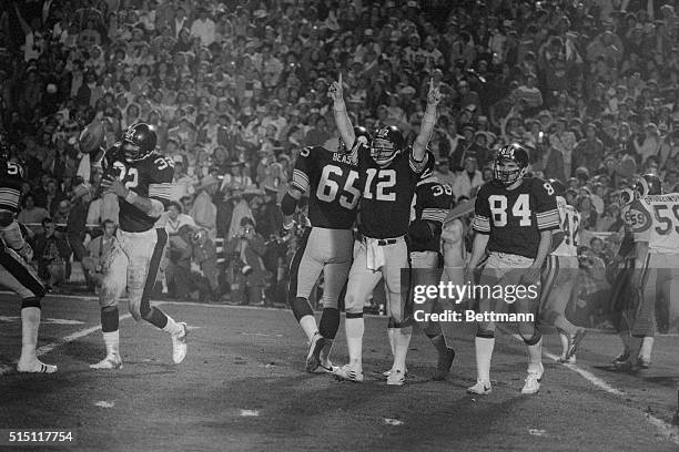 Pittsburgh Steelers quarterback Terry Bradshaw, who was named the Most Valuable Player of Super Bowl XIV at the Rose Bowl Jan. 20, holds his hands up...