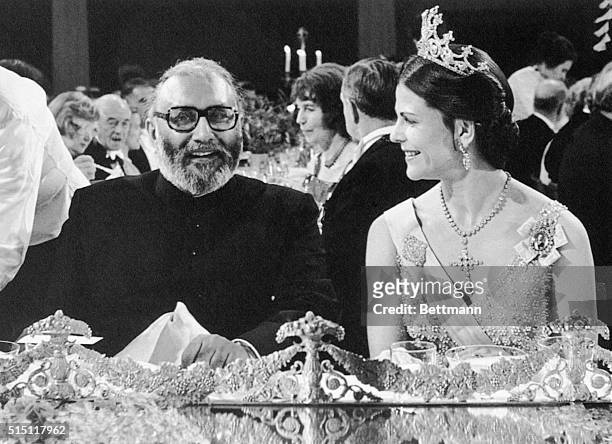 Stockholm, Sweden- Picture shows the Nobel Prize winner in physics, Abdous Salam, seated at a table with Queen Silvia, at the Nobel Prize Winners...