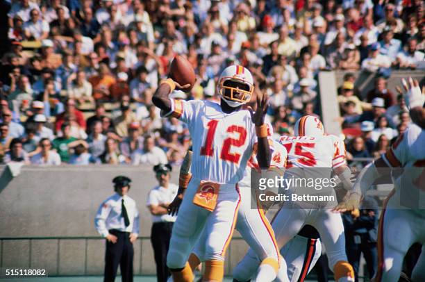 Doug Williams, quarterback for the Tampa Bay Buccaneers, seen in action passing ball.