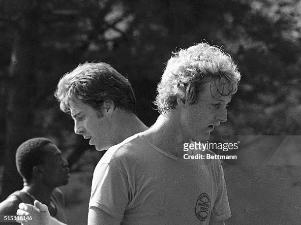 Boston Celtics' star rookie Larry Bird of Indiana State and the clubs veteran center Dave Cowens go over some plays during a session at the Team's...