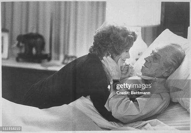 Melvyn Douglas, in the role of ailing financier Benjamin Rand, shares a tender moment with Shirley MacLaine, who plays his wife, Eve Rand in the film...