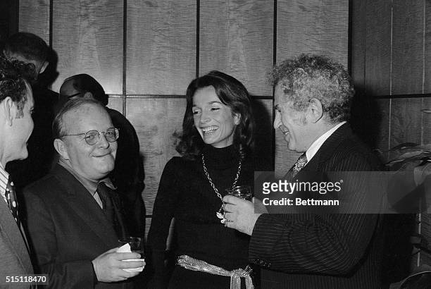 Writers get together at a cocktail party in New York December 19th. Truman Capote and Norman Mailer share the literary limelight with Princess Lee...