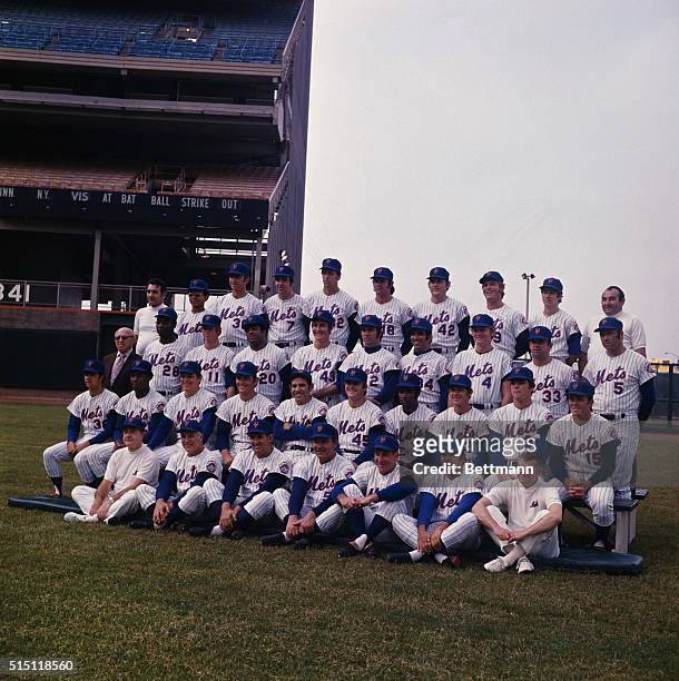 The New York Mets baseball team posing for a team photo. Front Row : Trainer Tom McKenna, coaches Bodie Yost, Sheriff Robinson, Rube Walker, and Joe...