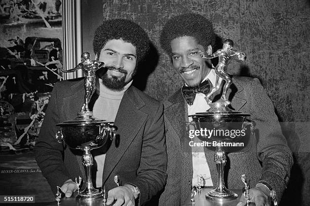 Franco Harris, , of the Pittsburgh Steelers and Willie Buchanon of the Green Bay Packers show their Bert Bell Memorial Trophies received, after being...