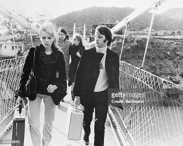 Crossing a bridge are Ringo Starr and his wife, Maureen, followed by fellow Beatle, Paul McCartney and his girlfriend, Jane Asher. They were on their...