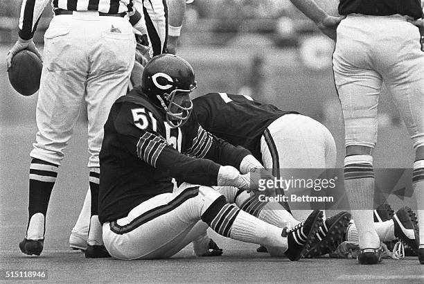 Bears' middle linebacker and leader of the defensive unit, Dick Butkus, sits alone with his thoughts after the 49ers' made long yardage during the...