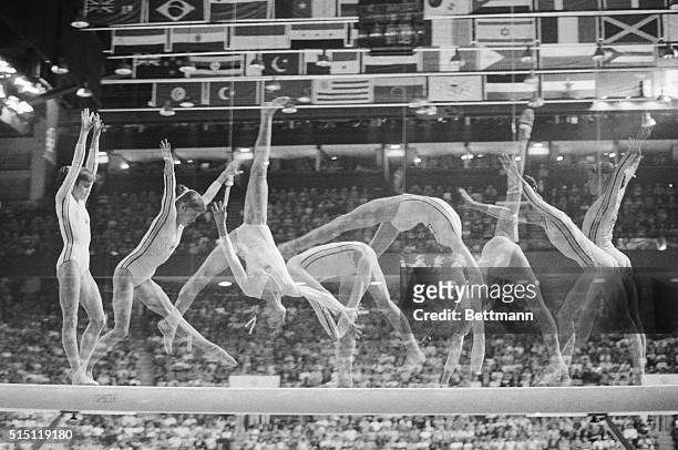 Multiple exposure show's Romania's Nadia Comaneci on the balance beam in Olympic women gymnastics 7/22, as she went on to win her second gold medal...