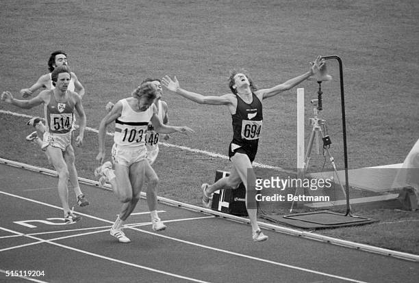 Montreal: New Zealand's John Walker stretches out his arms with joy as he wins the 1500 meter final 7-31. Second was Ivo Vandamme, Belgium, and third...