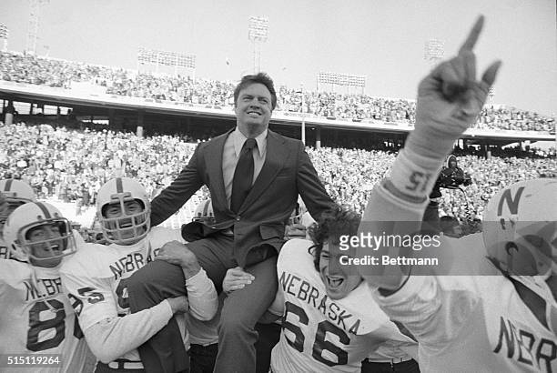 Dallas: A happy Nebraska coach, Tom Osborne, is carried on the shoulders of Mike Offner and John Bell after the Cornhuskers defeated the Longhorns of...