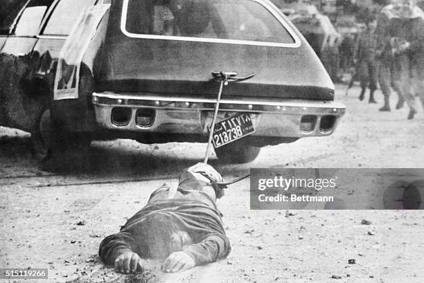 Lebanon Now. Beirut: Leftist gunmen in a car drag the body of a right-wing Phalangist during a March 21st assault on the Holiday Inn in Beirut....