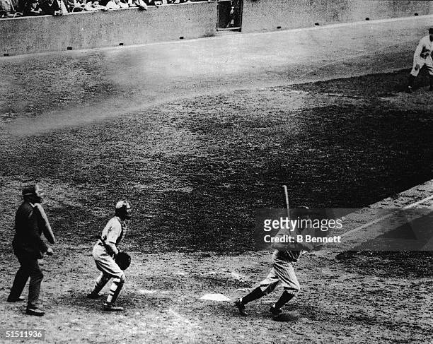 Legendary American baseball player Babe Ruth of the New York Yankees hits his 60th home run of the season against Washington Senators' pitcher Tom...
