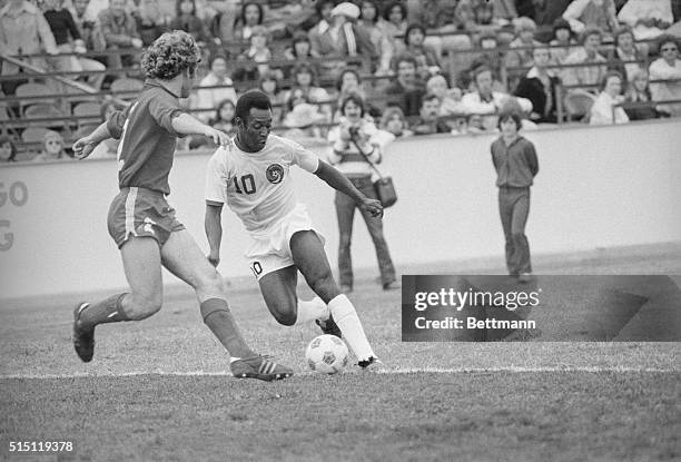 The New York Cosmos' Pele dribbles past the Dallas Tornado's Neil Cohen during the Cosmos' 1-0 exhibition victory in Dallas. Pele scored the only...