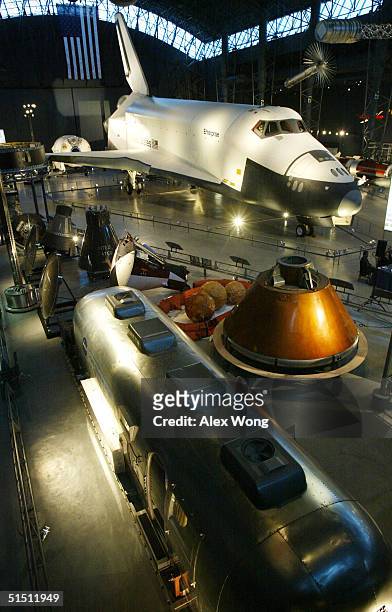 Artifacts, including space shuttle Enterprise and a mobile quarantine facility are displayed during a press preview of the James S. McDonnell Space...