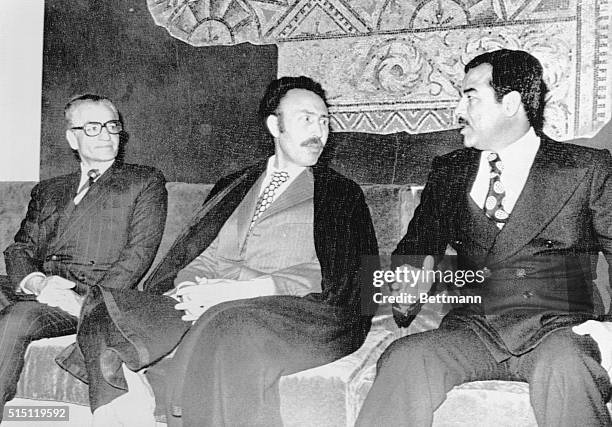 Algiers: Algeria's President Houri Boumedienne, , is flanked by Shah Mohammed Reza Pahlevi of Iran, , and Iraq's Saddam Hussein, , vice president of...