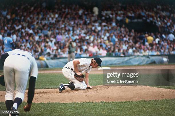 New York: Mark Fidrych, Detroit's flakey pitcher, goes through his act of patting and talking to the mound during a recent game. He makes his Yankee...
