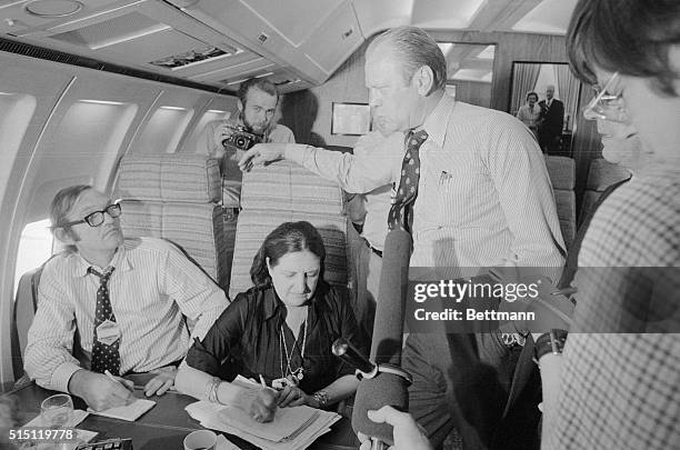 Helen Thomas is shown at President Ford's elbow and Dave Kennerly in background.