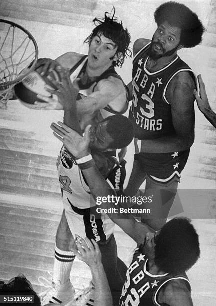 Denver Nuggets Gus Gerard and Ralph Simpson steal a rebound away from the ABA All-Stars basket during 2nd period action 1/27. All-Stars Artis Gilmore...