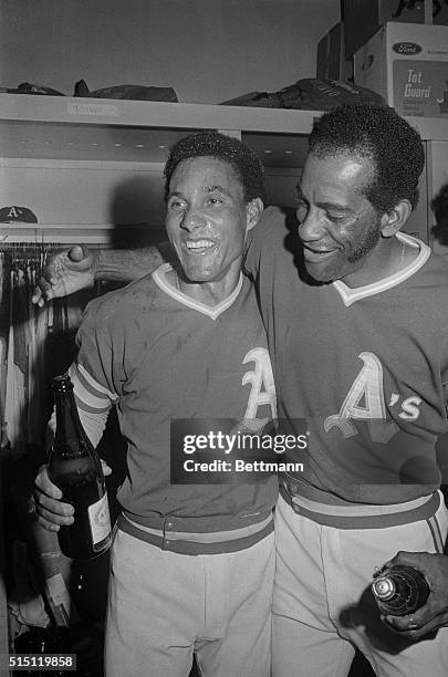 Happy twosome, Bert Campaneris, and Alvin Lewis, had champagne poured on themselves after the Oakland A's won their second consecutive World...